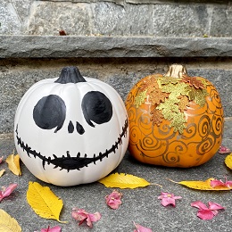 painted halloween pumpkins, once white, one gold