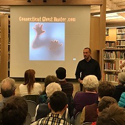 Connecticut Ghost Hunter presenting PowerPoint to a crowd at the Library