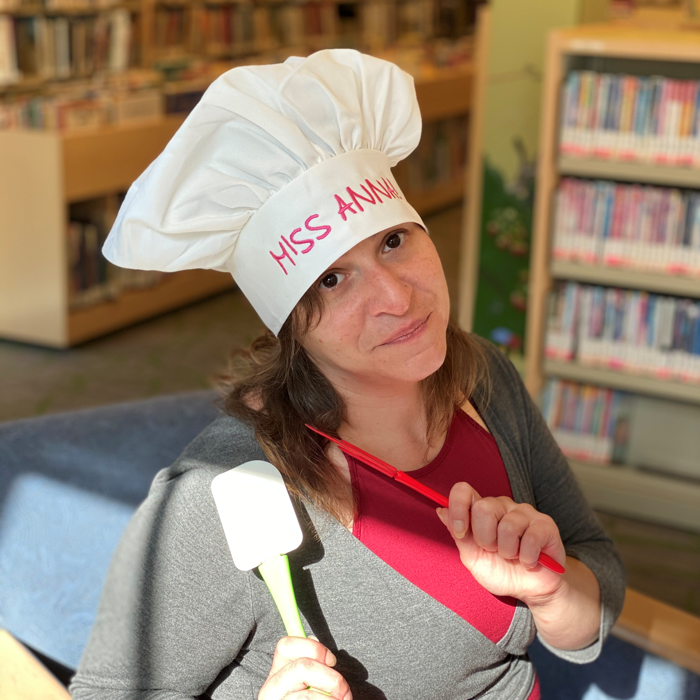 Miss Anna with a Chef's Hat on holding a spatula