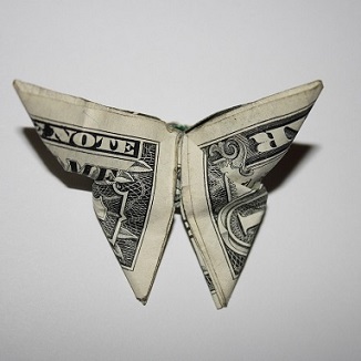 dollar bill folded into a butterfly