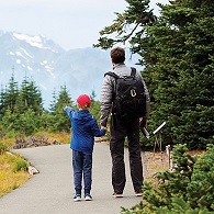 Father and son hiking in the woods