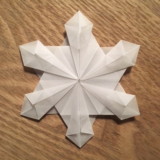 origami paper folded into a snowflake