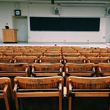 empty college classroom with chairs and blackboard