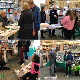 groups of people visiting tables at the library