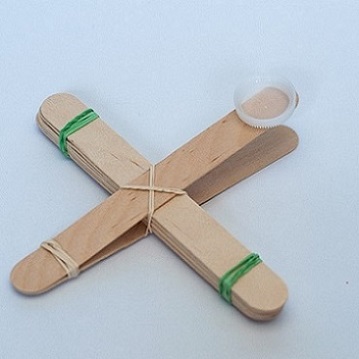 catapult made from tongue depressors and elastic bands