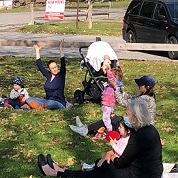 families participating in storytime on the lawn