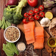 array of grains, salmon, broccoli and cherry tomatoes