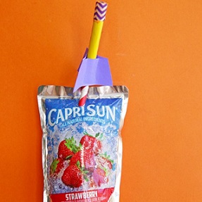 empty capri sun package with straw