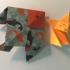 origami paper shaped into a fish and a fox