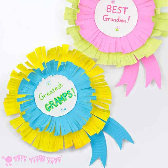 colorful paper rosettes with the words Greatest Gramps and Best Grandma on them