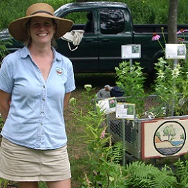 woman in front of gardening cart