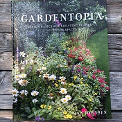 "Gardentopia" book cover with beautiful garden on the front