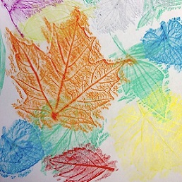 colorful leaf rubbings in orange, blue, yellow, red and green