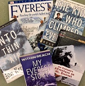 Five books about Mt Everest arranged on a table