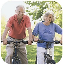 image of two senior adults riding bikes
