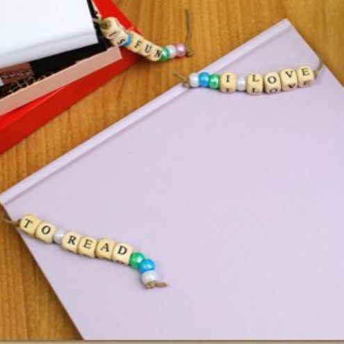 beaded bookmark with wooden beads that spell out I love to Read