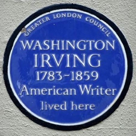 Blue circular house marker that reads Washington Irving 1783-1859 American Writer lived here