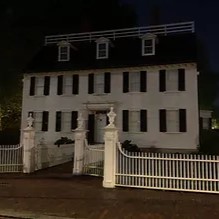 Haunted house behind spiked fence in Salem. MA