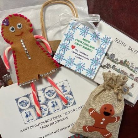 gingerbread person made of felt with candy cane limbs, small burlap bag with gingerbread person on it
