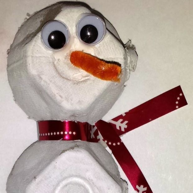 egg carton cups decorated with googly eyes and ribbon to look like snowman
