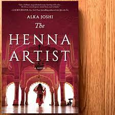 book cover showing woman with veil in a palace beneath the words The Henna Artist