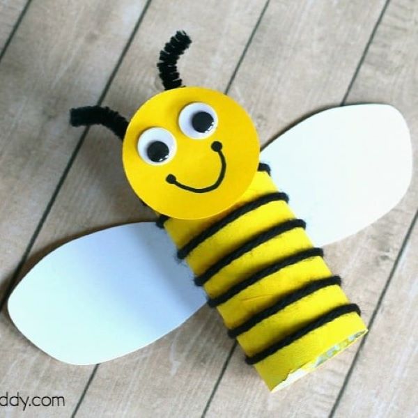 bumble bee made from cardboard tube, yellow marker, black yarn and face and wing cut-outs