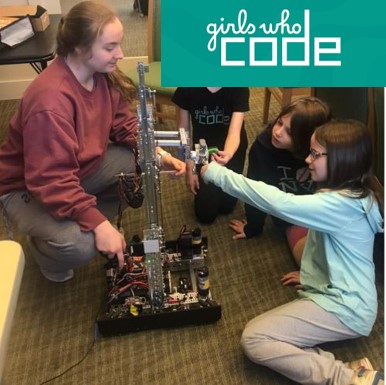 girls playing with robot