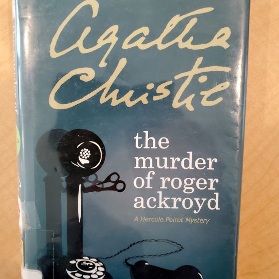 Book with cover title The Murder of Roger Ackroyd with image of an old time rotary phone