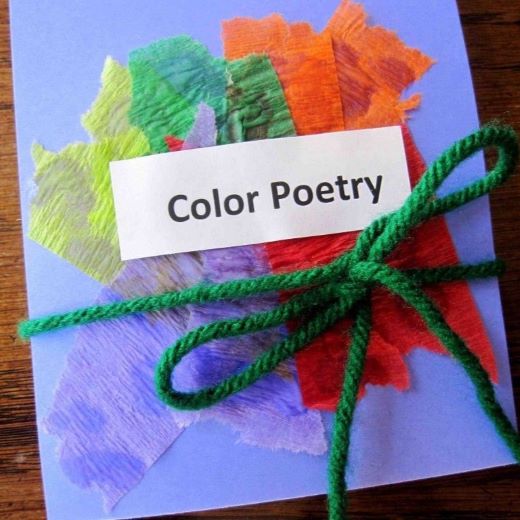 construction paper with piles of colorful tissue paper, wrapped in a string