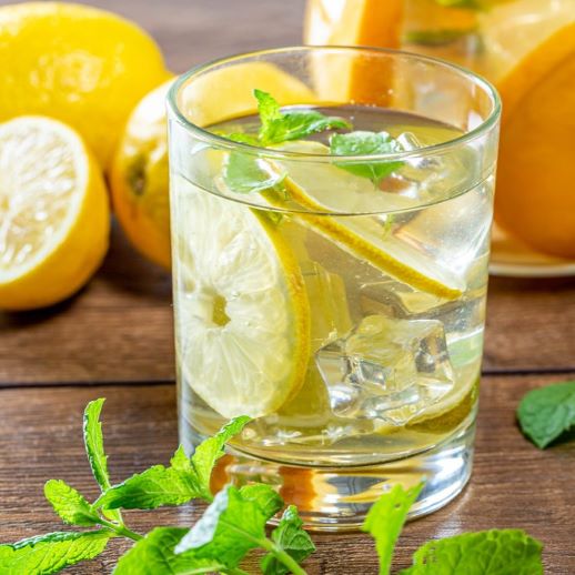 cool summer drink with lemons and mint leaves