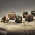 dungeons and dragons dice on marble slab