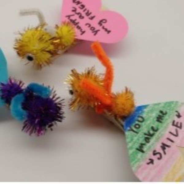 insects made from pipe cleaners and paper hearts
