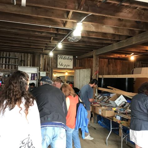 people inside barn shopping for treasures