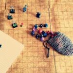 bag with Dungeons & Dragon stones and figures