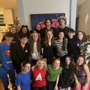 group of teens in Halloween costumes