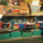 bins of labeled craft supplies: pictures, cupcake liners, popsicle sticks