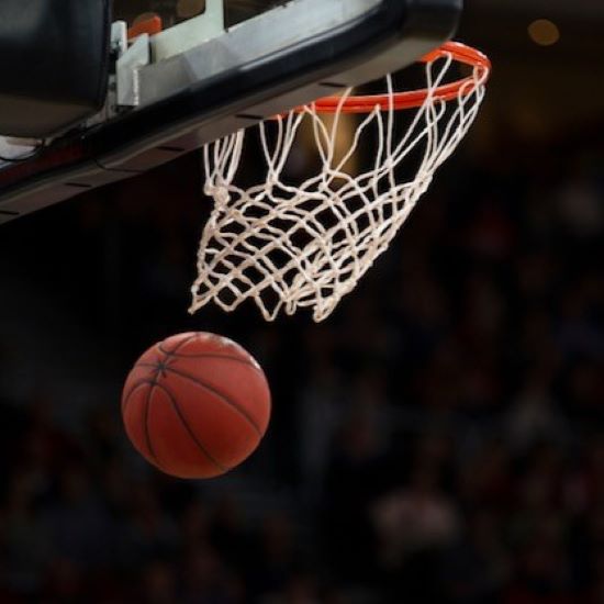 basketball soaring through a hoop