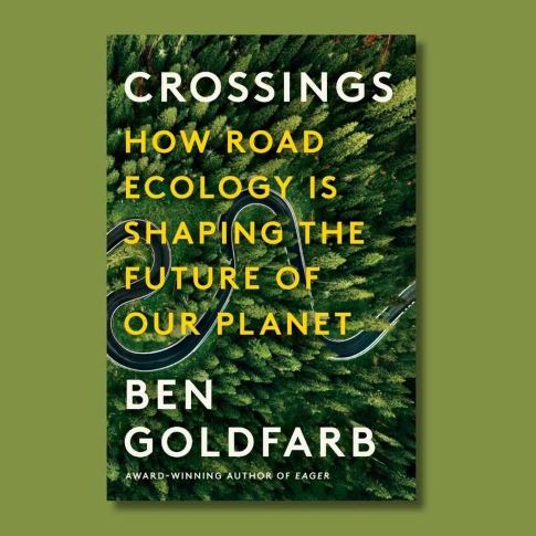 book jacket with birds-eye view photo of road cutting through the forest behind the works Crossings How Road Ecology is Shaping the Future of the Planet