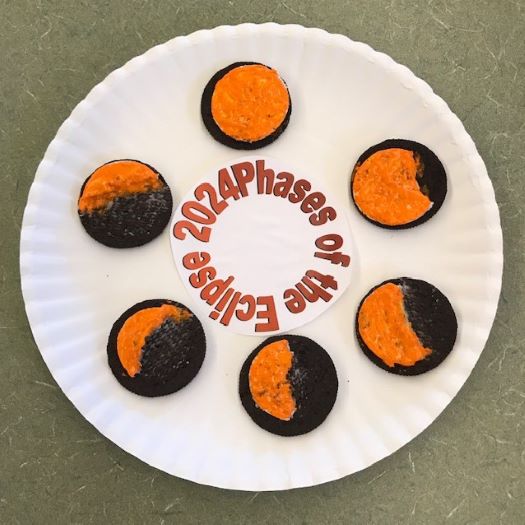 oreo cookies arranged on a plate to depict the phases of the eclipse