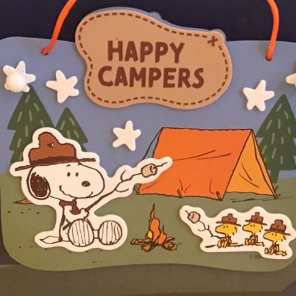 craft of snoopy roasting marshmallows with three yellow birds near a tent