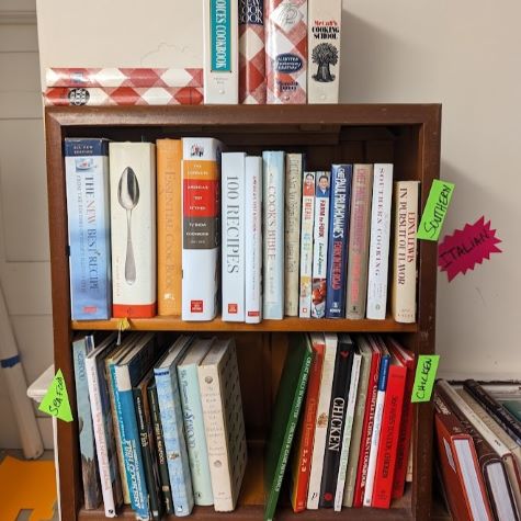 cookbooks arranged on small shelf