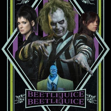 Beetlejuice character flanked by two women with works Beetlejuice Beetlejuice