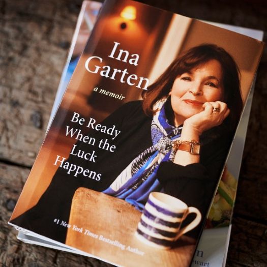 Book cover featuring a woman with chin resting on hand seated at a table with book title "Be Ready When the Luck Happens."