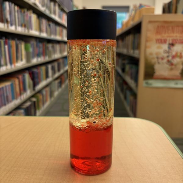 plastic container turned into a lava lamp by adding oil and red food coloring