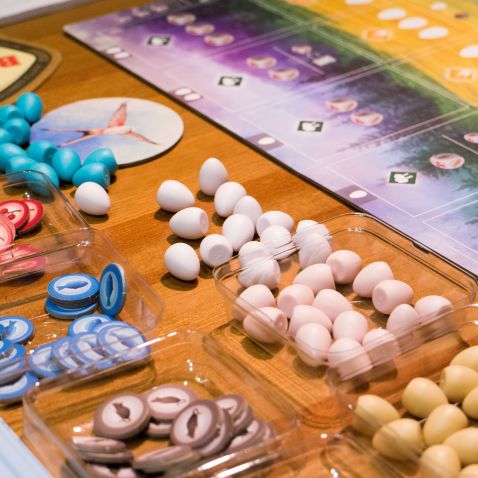 board game pieces next to game board