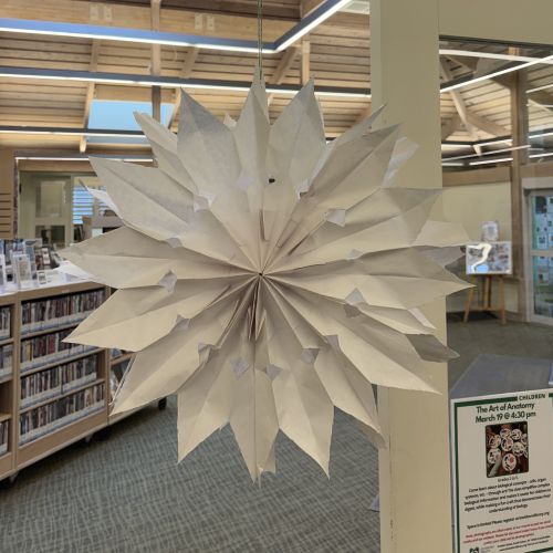 paper snowflake hanging in doorway