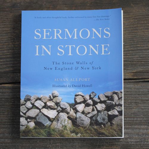 Book featuring photo of a stone wall against a blue sky, with title above it "Sermons in Stone"