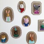 3D Animal Portraits made from paper and cardboard, hanging on a wall