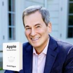Portrait of David Pogue with image of book Apple The First 50 Years in the corner.