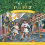 Book cover of Magic Tree House Book 13 Vacation Under the Volcano featuring two children in ancient clothing running away from a volcano exploding in the backgroun